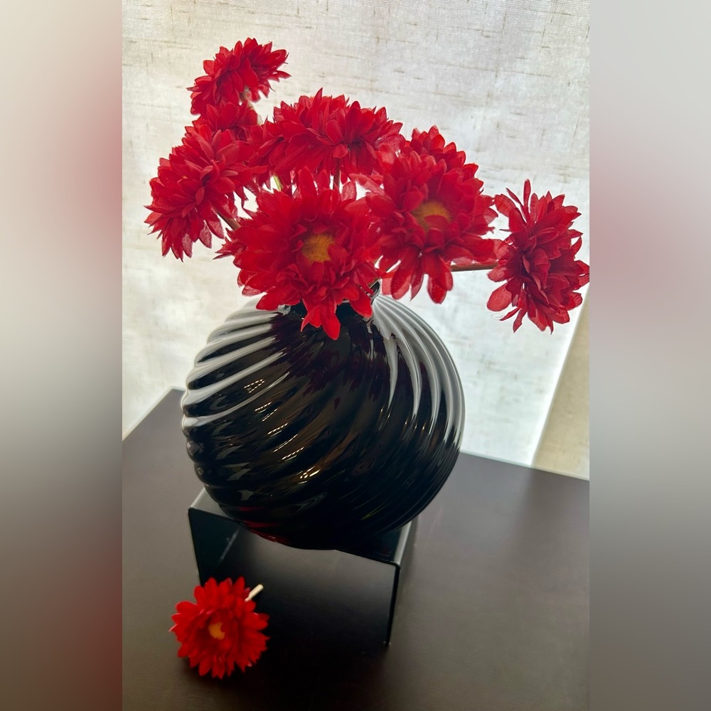 Round, black art vase